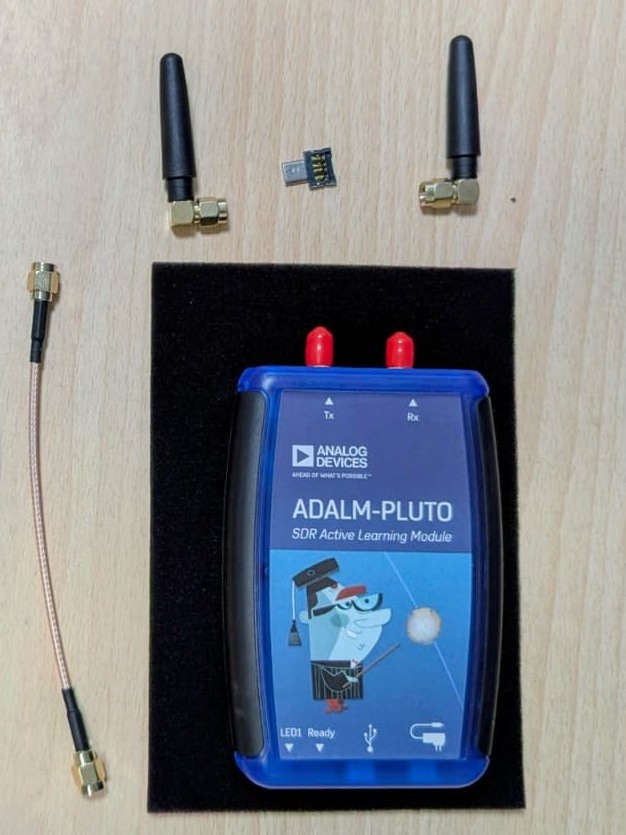 ADALM-PLUTO SDR active learning module with its two antennas and an SMA cable